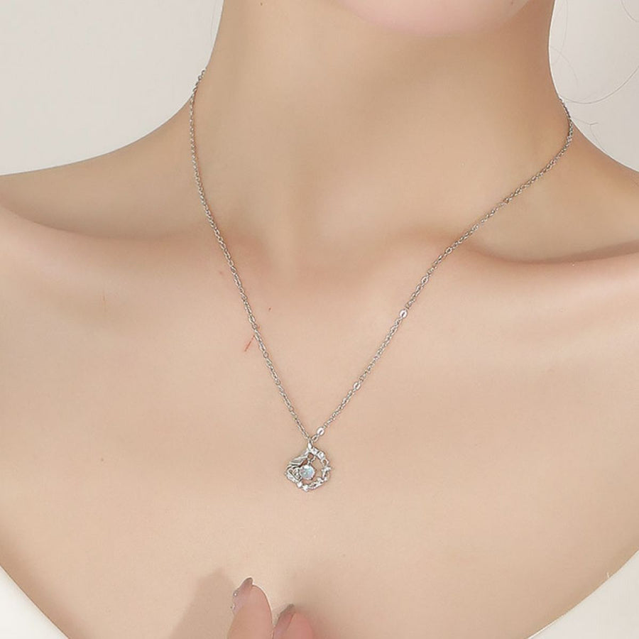 opalescent white necklace featuring pendant and floral