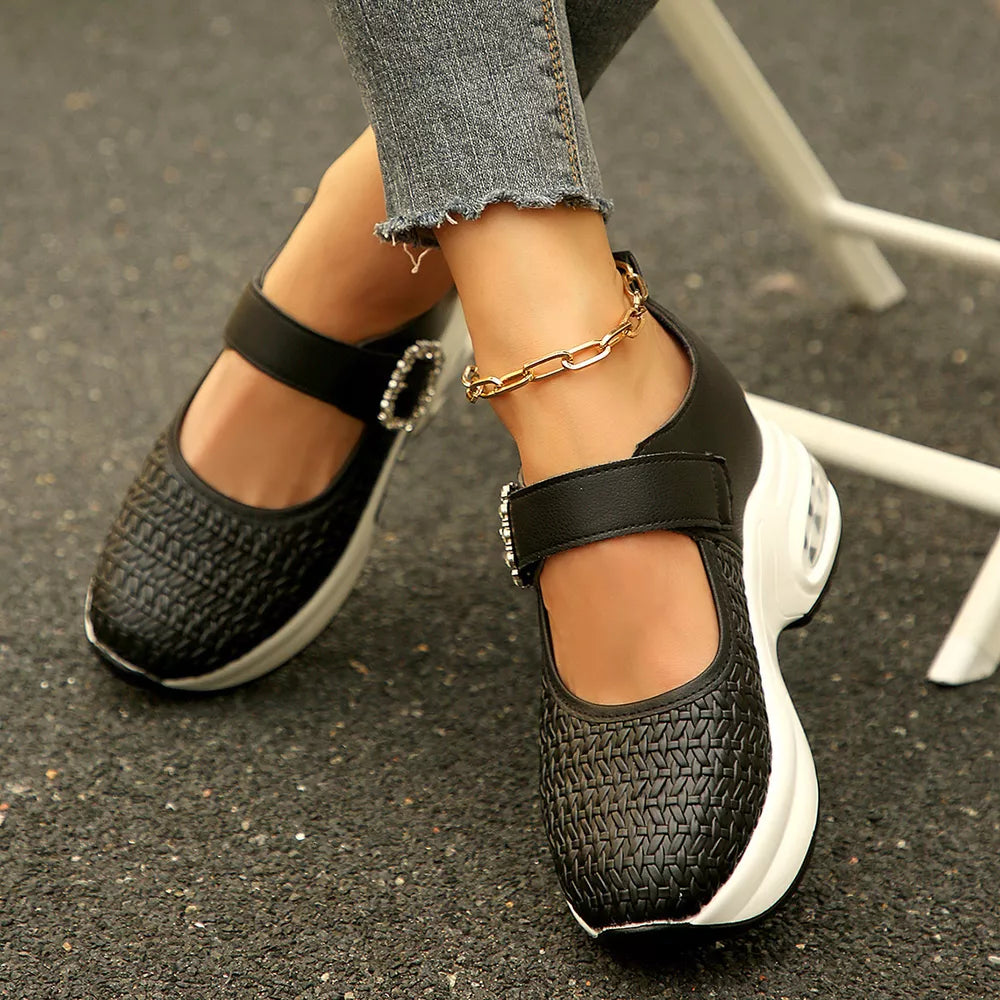 white Mary Jane shoes featuring rhinestone buckle and woven texture