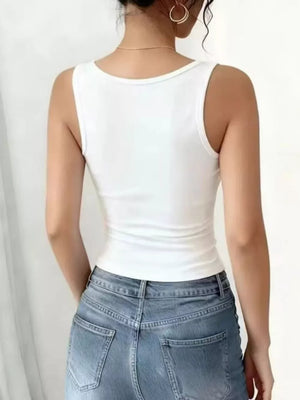 White ribbed V-neck tank top with delicate lace trim detail.