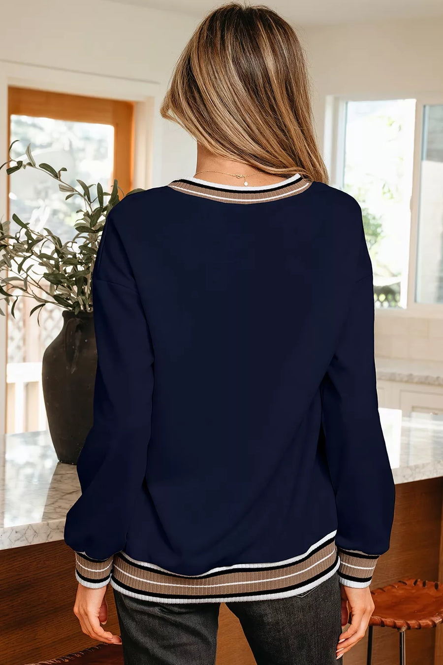 white sweatshirt featuring stretch and striped