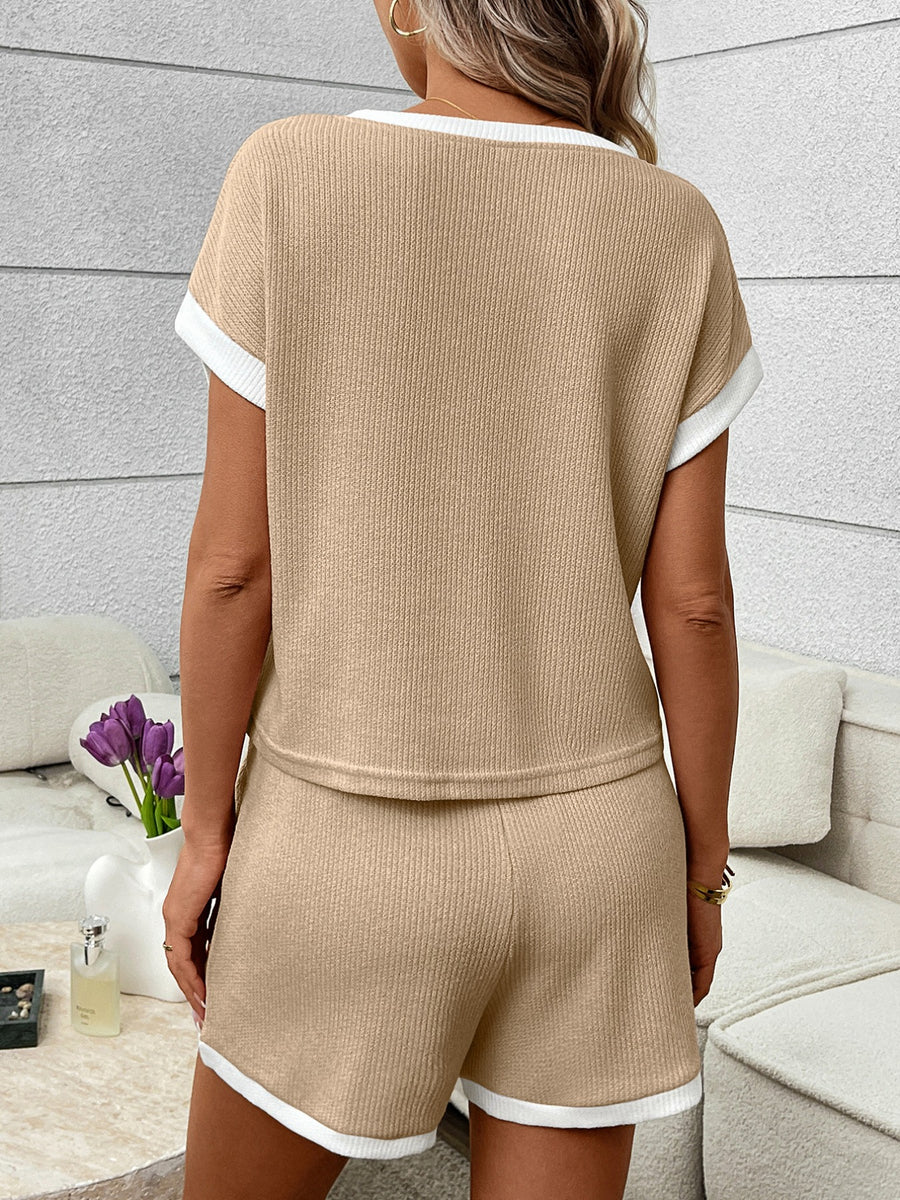 Khaki ribbed knit two-piece set with white trim, featuring short sleeves and shorts.