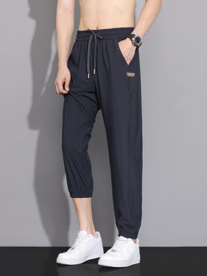 95%polyester,5%spandex Care instructions: Machine wash cold joggers in Black with loose silhouette