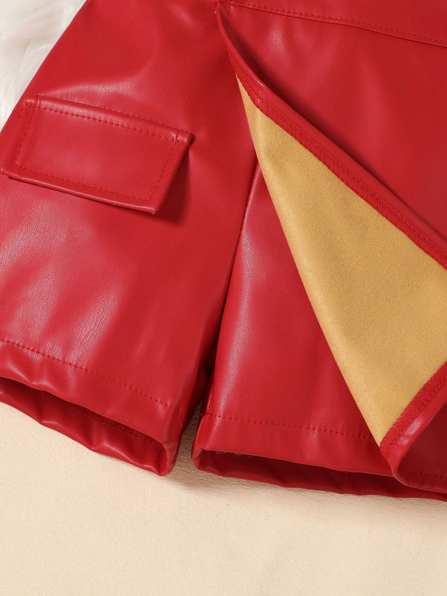 Red leather shorts with flap pocket detail and tan lining.