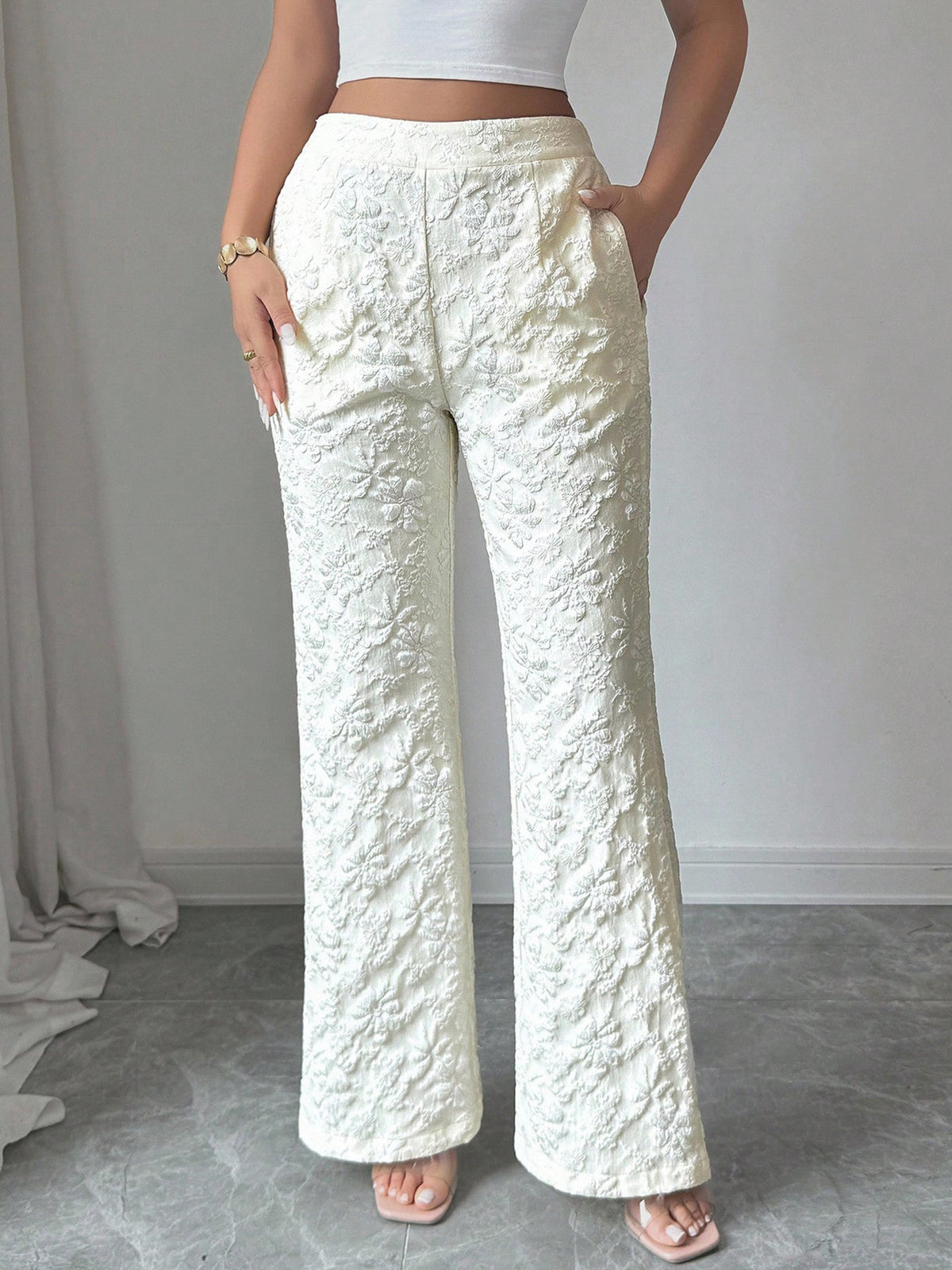 Textured high-waist wide-leg maternity pants with pockets in cream.