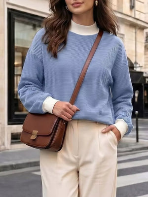 light blue sweatshirt with ribbed cuffs and long sleeve