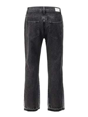 Dark two-tone denim bootcut jeans with raw hem detail