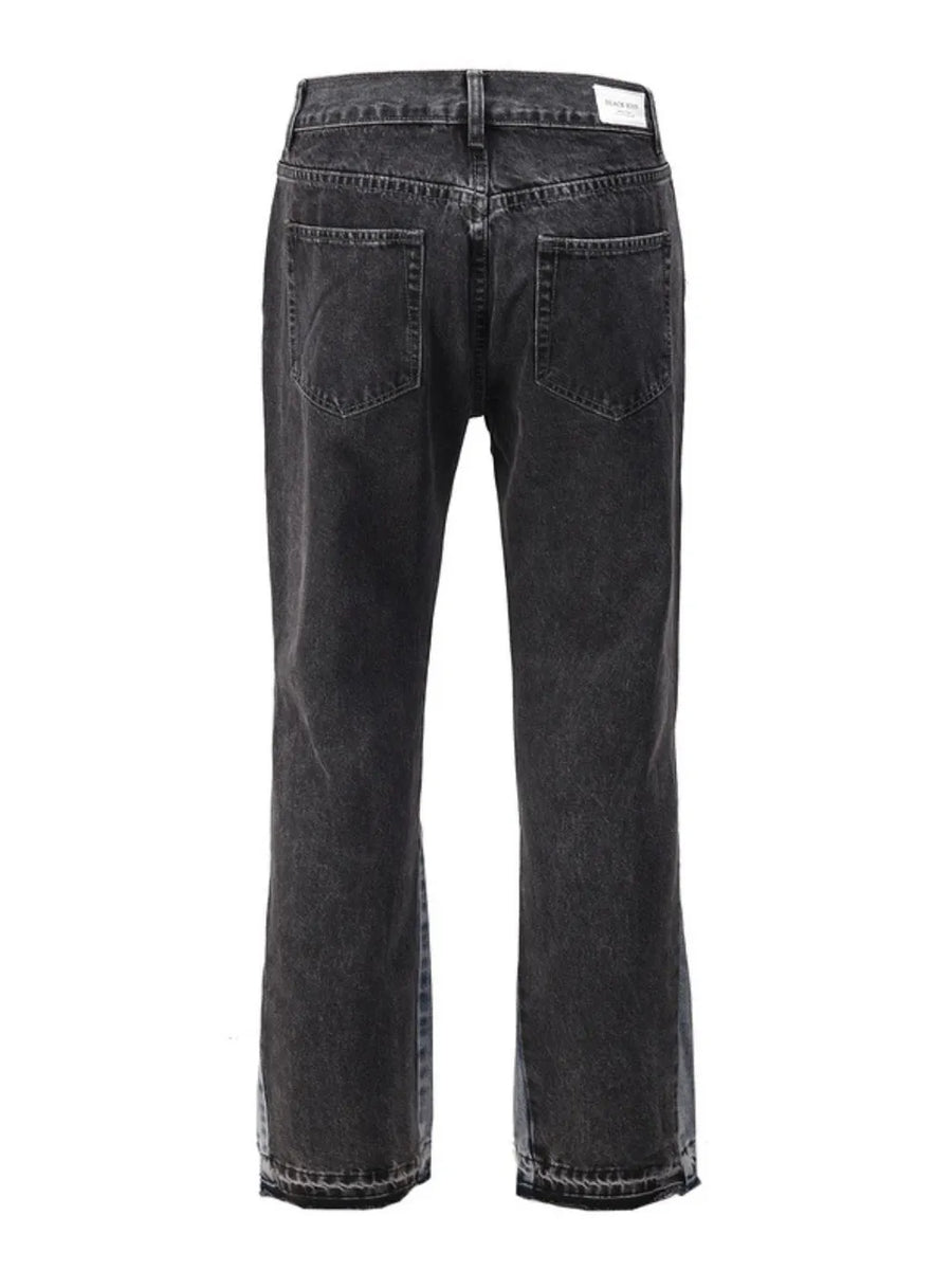 Dark two-tone denim bootcut jeans with raw hem detail