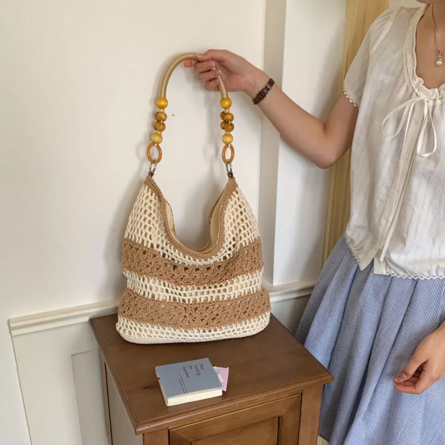 light brown handbag featuring crochet knit and striped