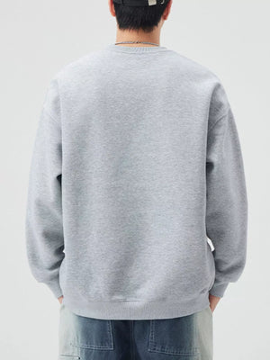 Oversized Melange Gray crew-neck sweatshirt with ribbed cuffs and hem.