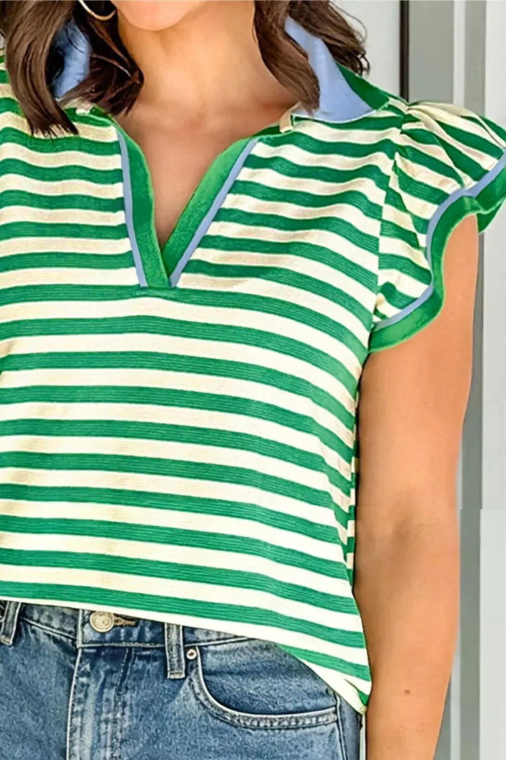Green and cream striped cotton blouse with ruffled sleeves and a polo collar.