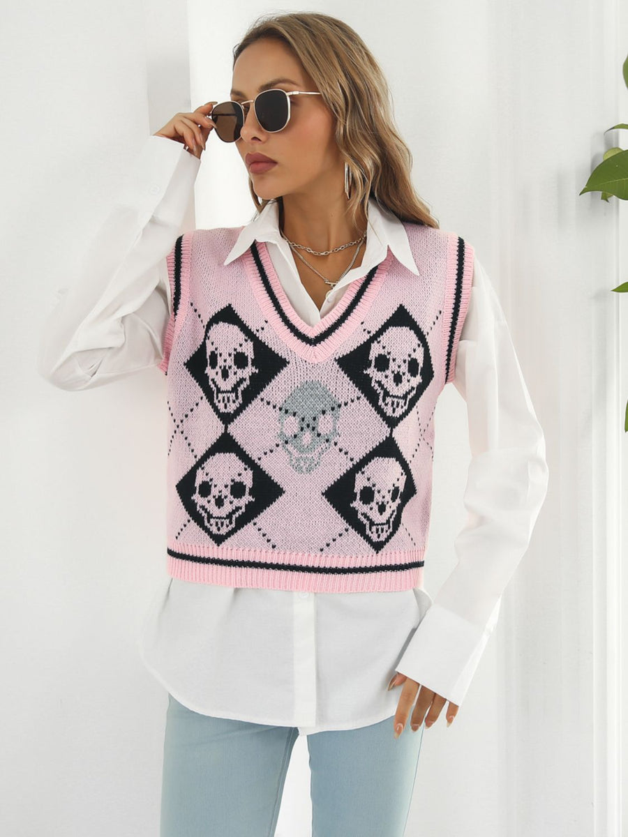 Pink argyle knit vest with black skull motif and V-neck.