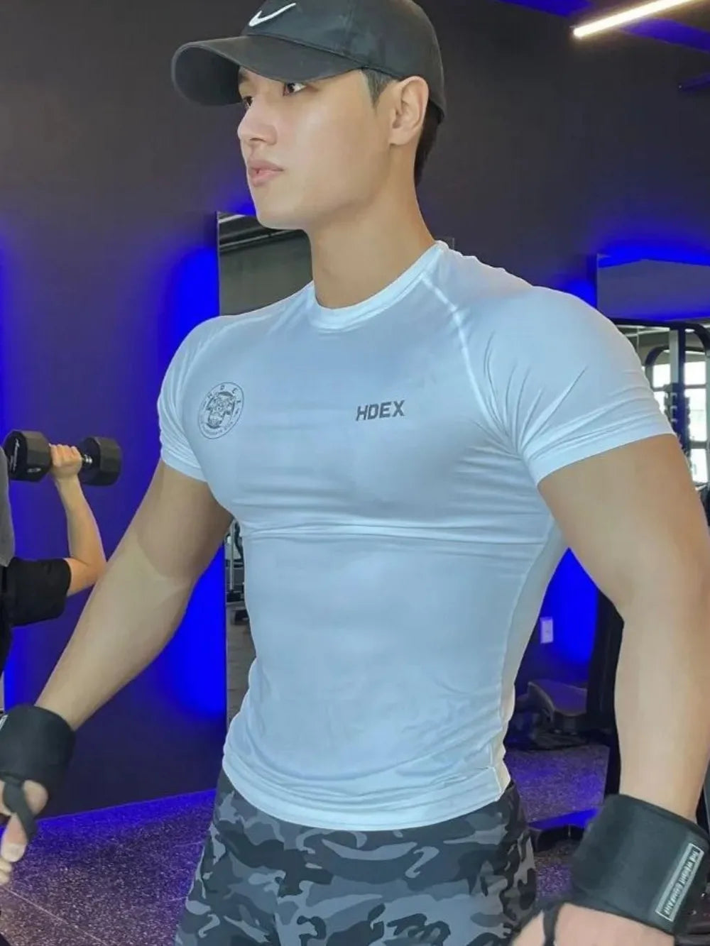 White crew neck athletic t-shirt with HDEX logo and graphic detail.