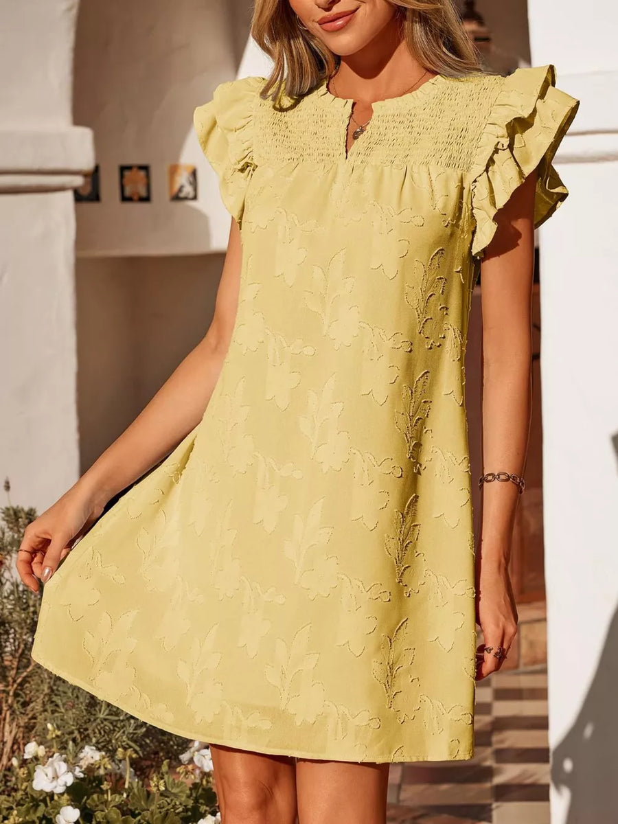 Apricot floral embossed mini dress with smocked bodice and ruffled sleeves.