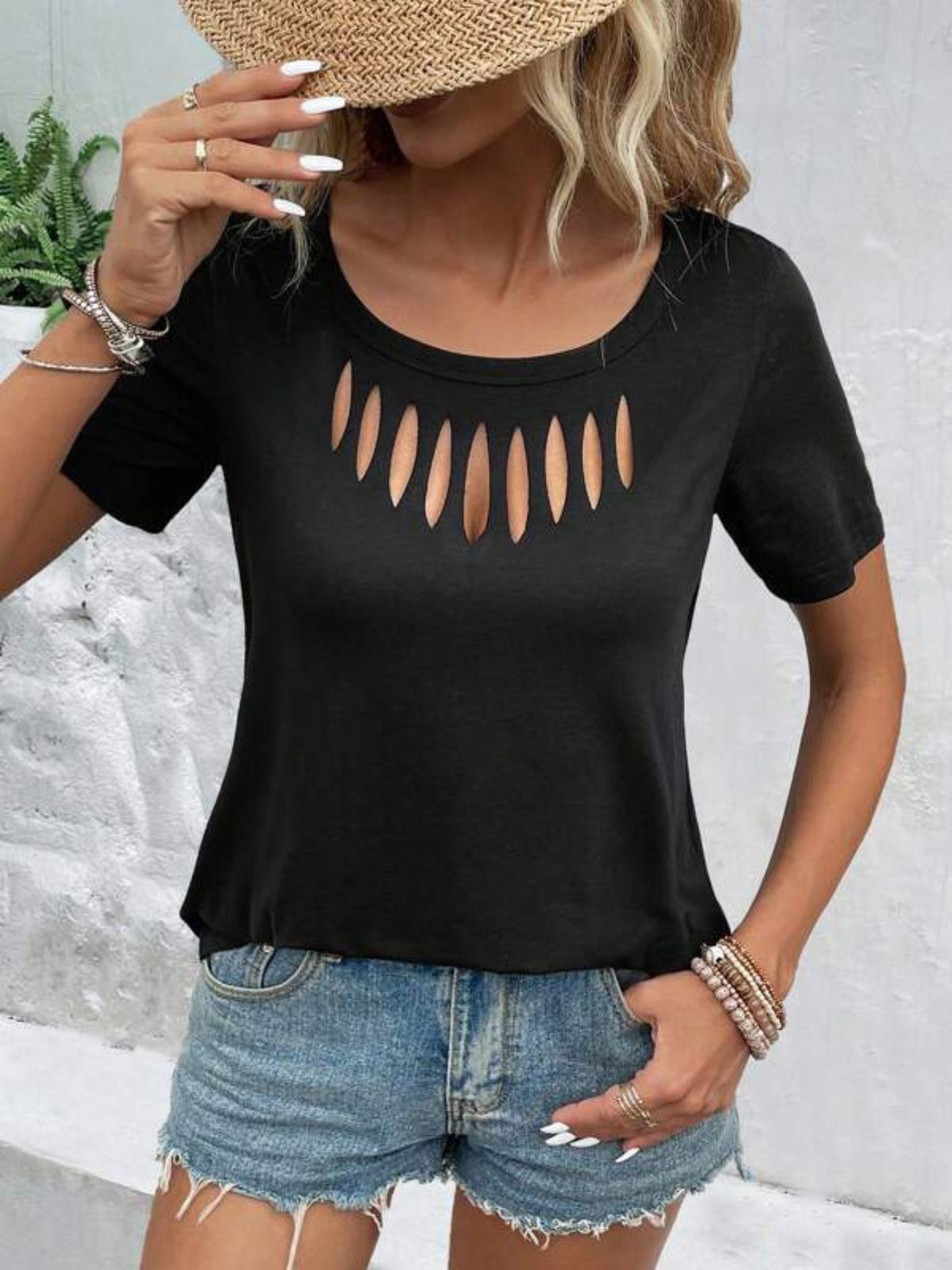 Black short-sleeve t-shirt with a scoop neck and a cutout detail across the chest.