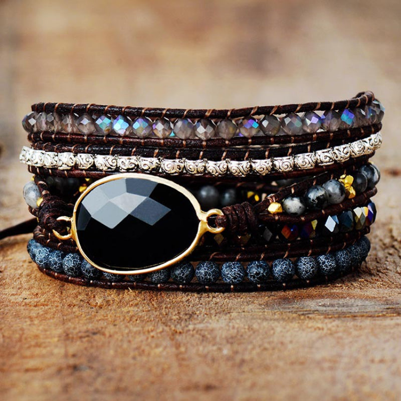 Black gemstone and bead wrap bracelet with leather cords and alloy accents.