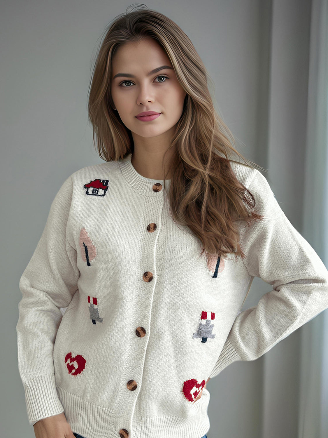 White acrylic button-up cardigan with embroidered storybook motifs and round neckline.