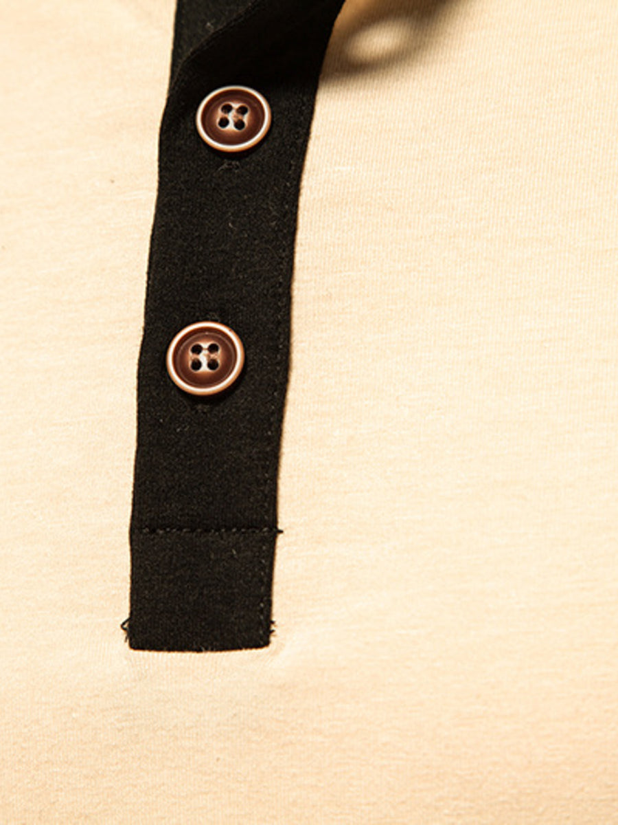 Men's long sleeve henley t-shirt in beige with black placket and brown buttons.