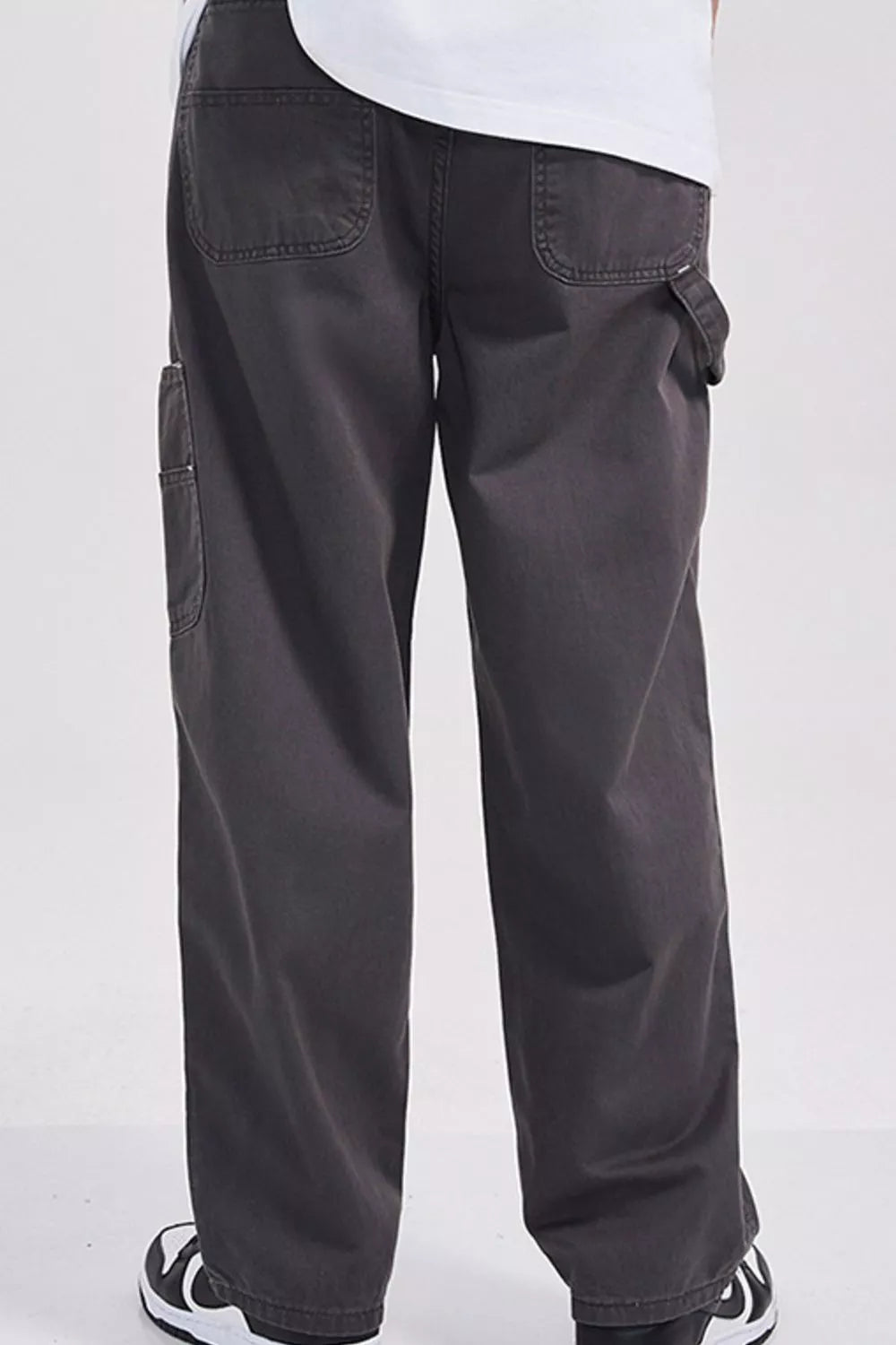 Relaxed fit dark gray cargo sweatpants with utility details and back pockets.