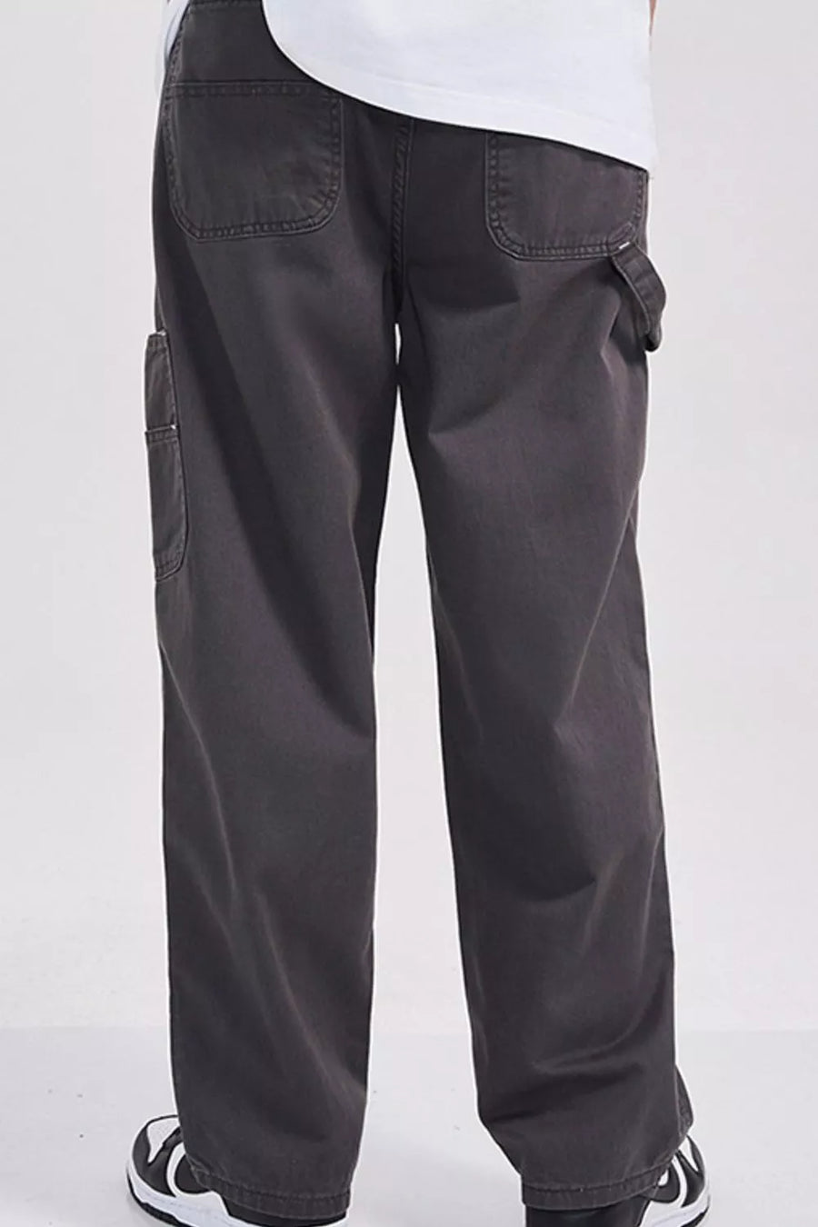 Relaxed fit dark gray cargo sweatpants with utility details and back pockets.