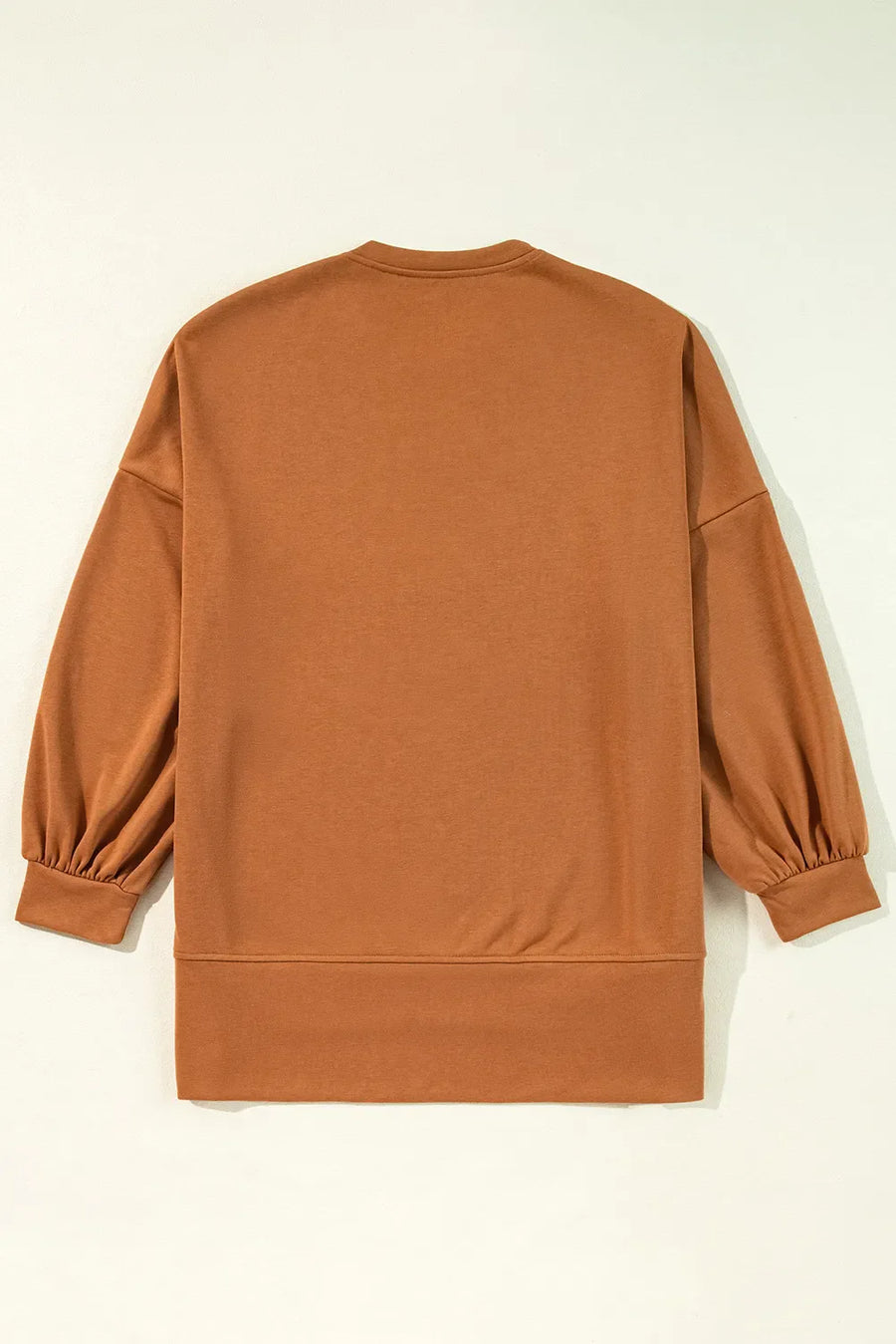 Caramel graphic sweatshirt with balloon sleeves and slit hem detail