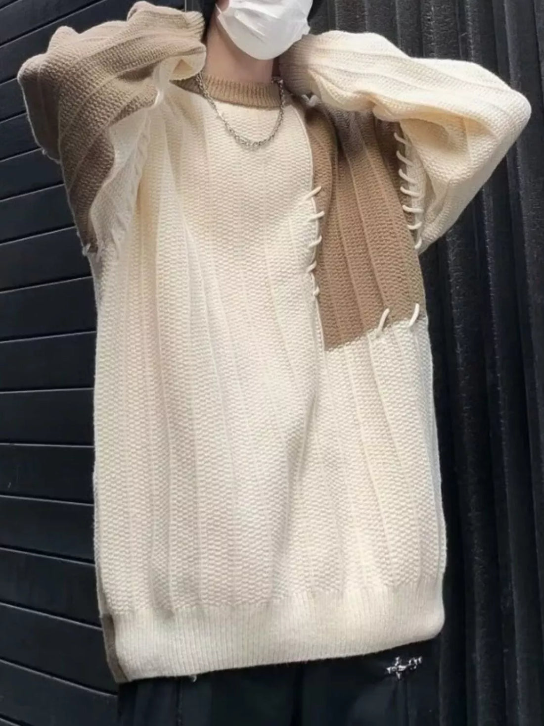 Oversized white and khaki color block knit sweater with contrast stitching detail.