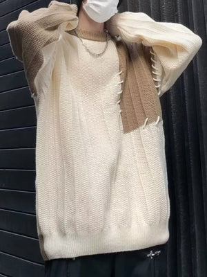 Oversized white and khaki color block knit sweater with contrast stitching detail.