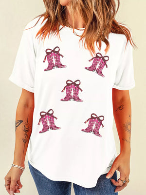 White graphic tee with sequined pink cowgirl boots print and bow details.