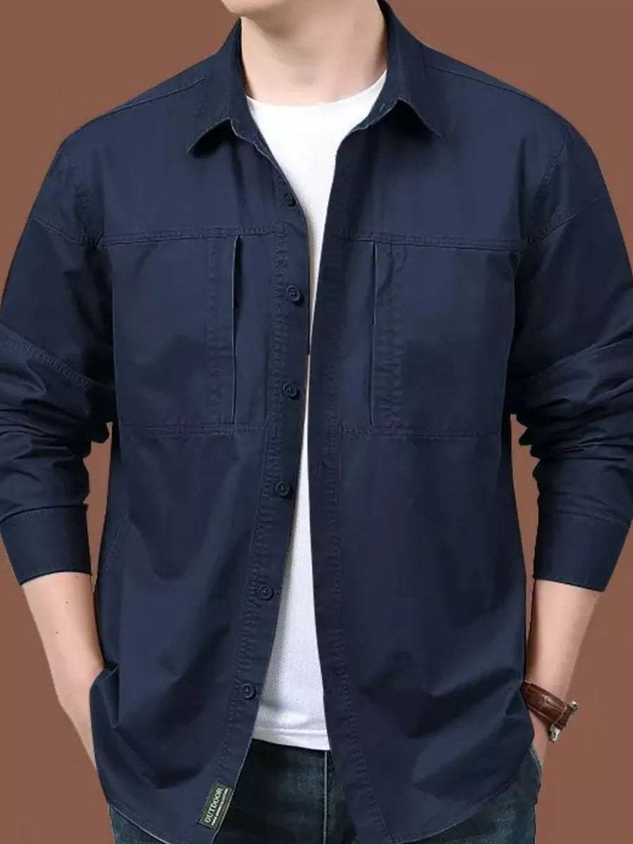 Men's dark blue relaxed fit cotton shirt with button front and chest pockets.