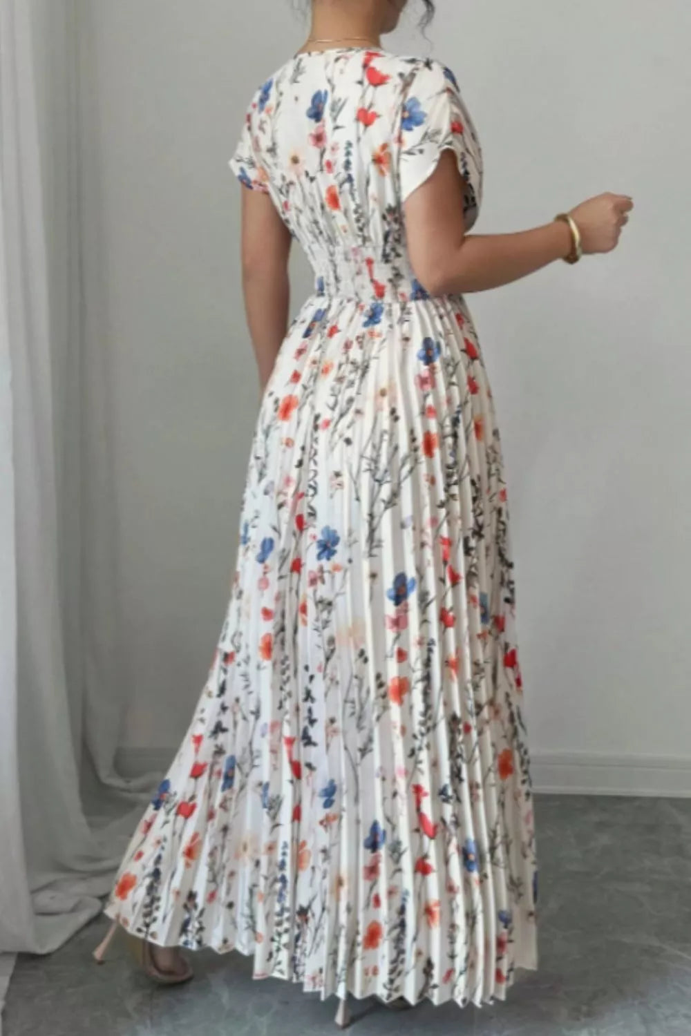 Floral print maxi dress with flutter sleeves and pleated skirt