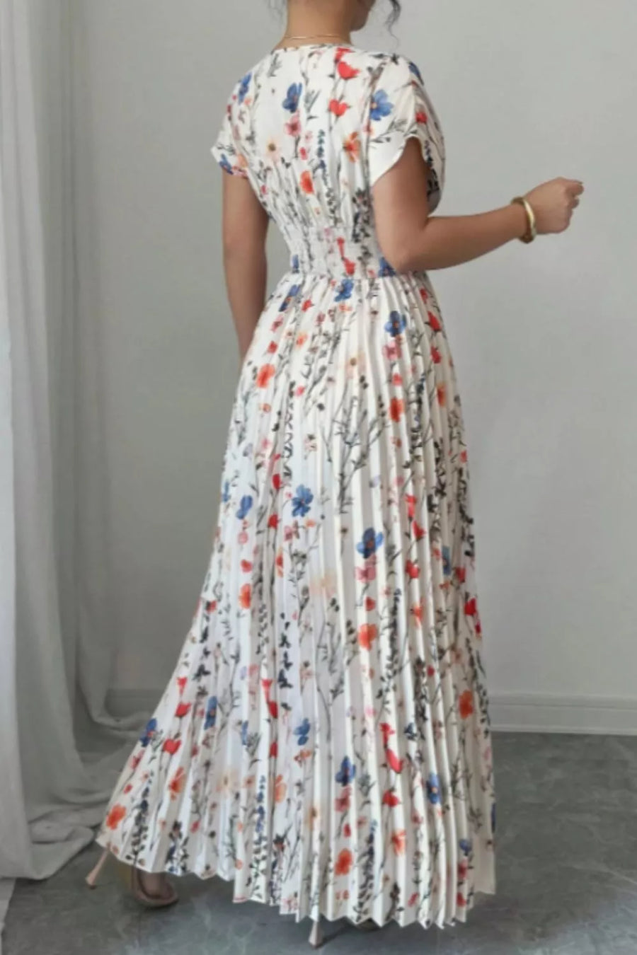 Floral print maxi dress with flutter sleeves and pleated skirt
