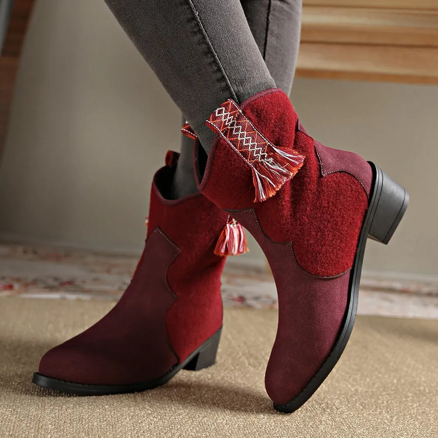 Burgundy suede and felt ankle boots with embroidered trim and tassels.