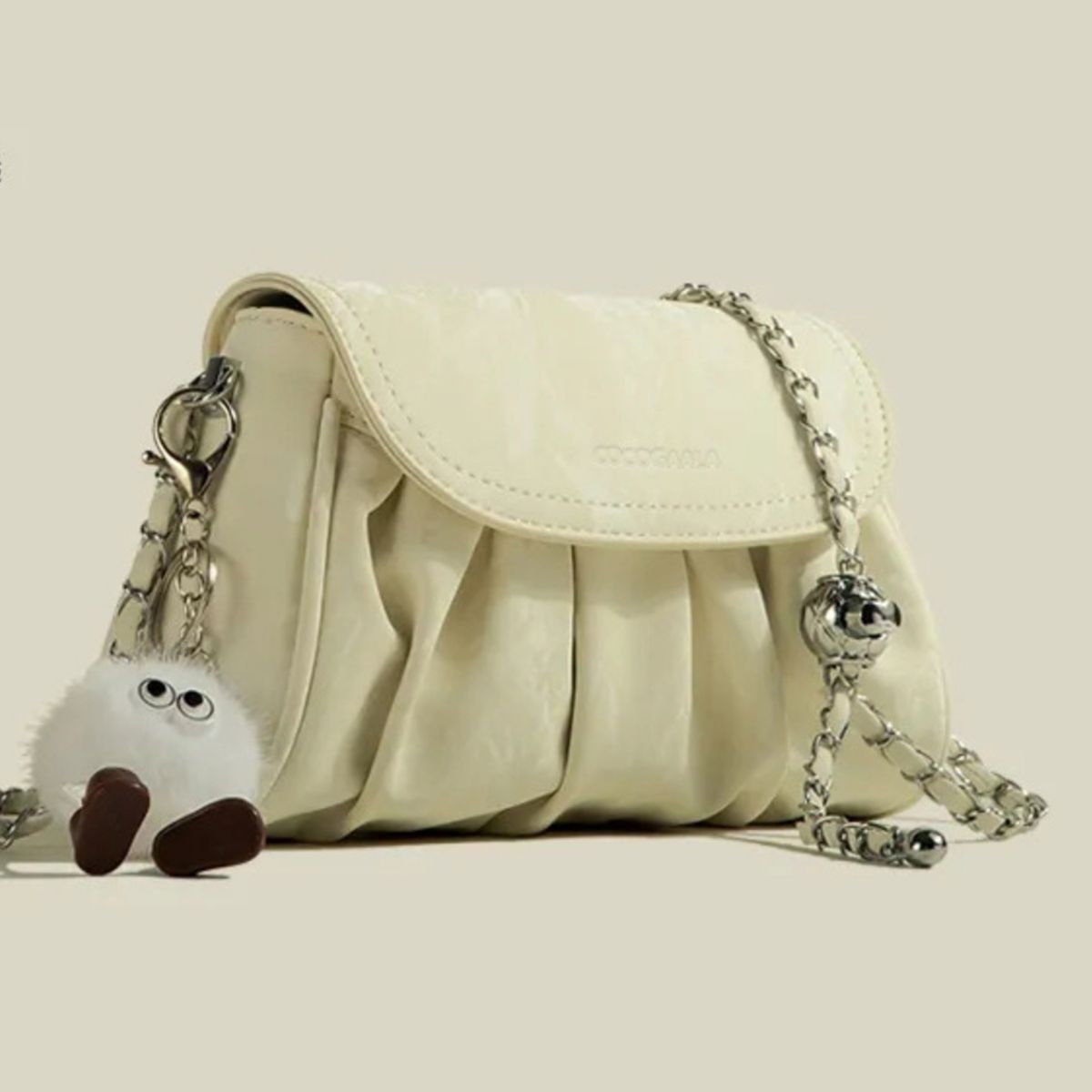 Mini ruched pu leather shoulder bag in pastel yellow with chain strap and fuzzy charm