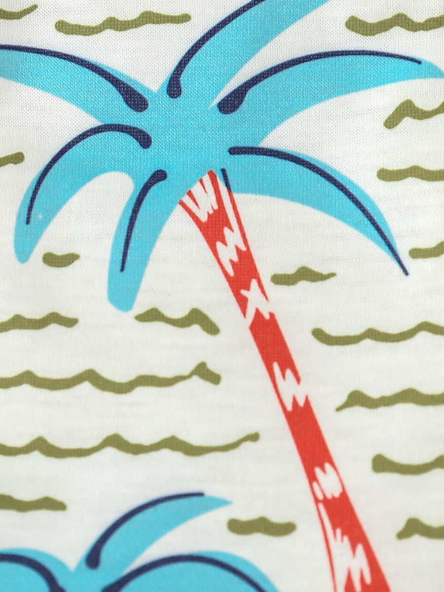 Baby set with tropical palm print, cotton fabric, and drawstring detail.