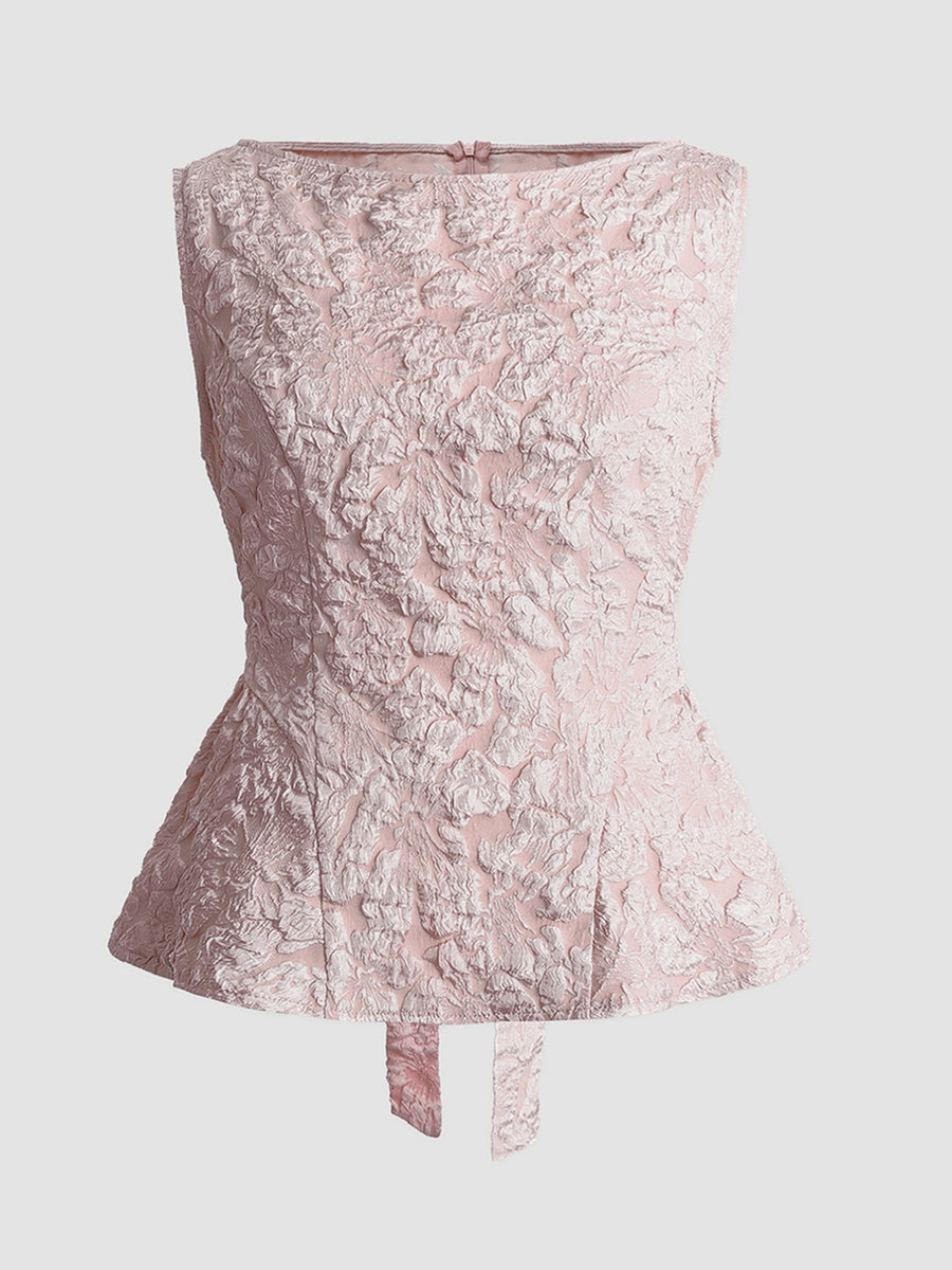 Dusty pink textured floral peplum tank top with boat neckline and tie detail.
