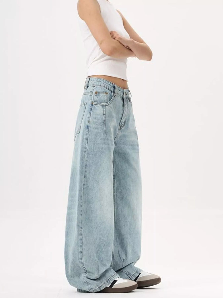 Men's light blue wide-leg stretch jeans with a relaxed fit and classic silhouette.