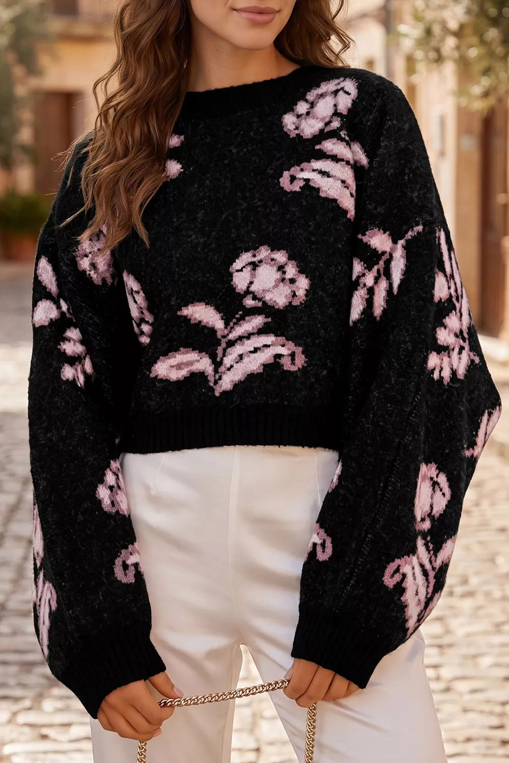 black pullover sweater with floral and crew neck