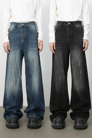 Oversized palazzo jeans in dark wash and medium wash denim with a distressed effect.