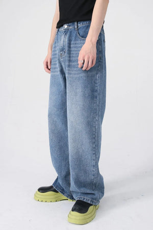 Light blue denim jeans with a relaxed, wide-leg fit and modern wash.