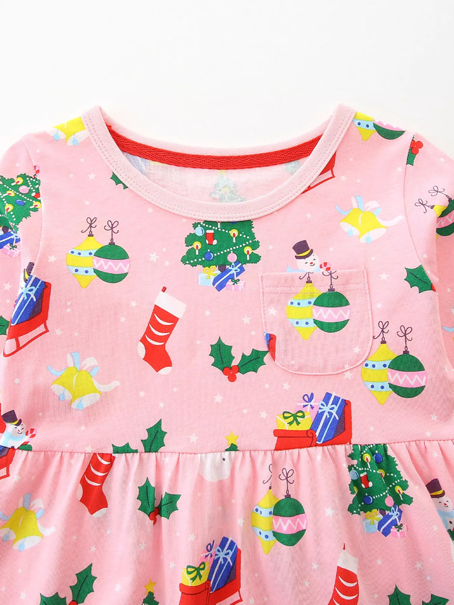Pink long-sleeve baby dress with Christmas print, featuring trees, ornaments, stockings, and snowmen.