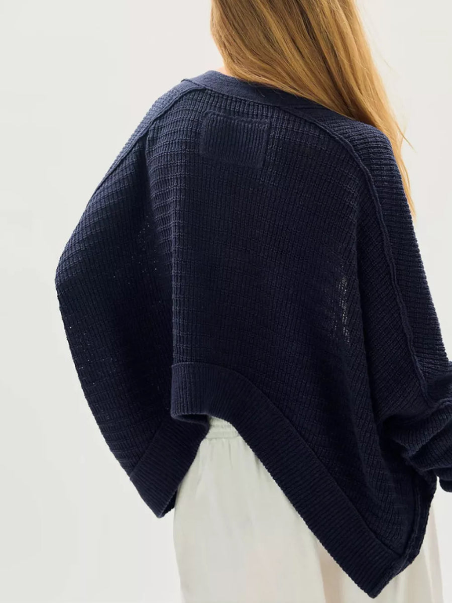 pale yellow cardigan with seam detail and long sleeve