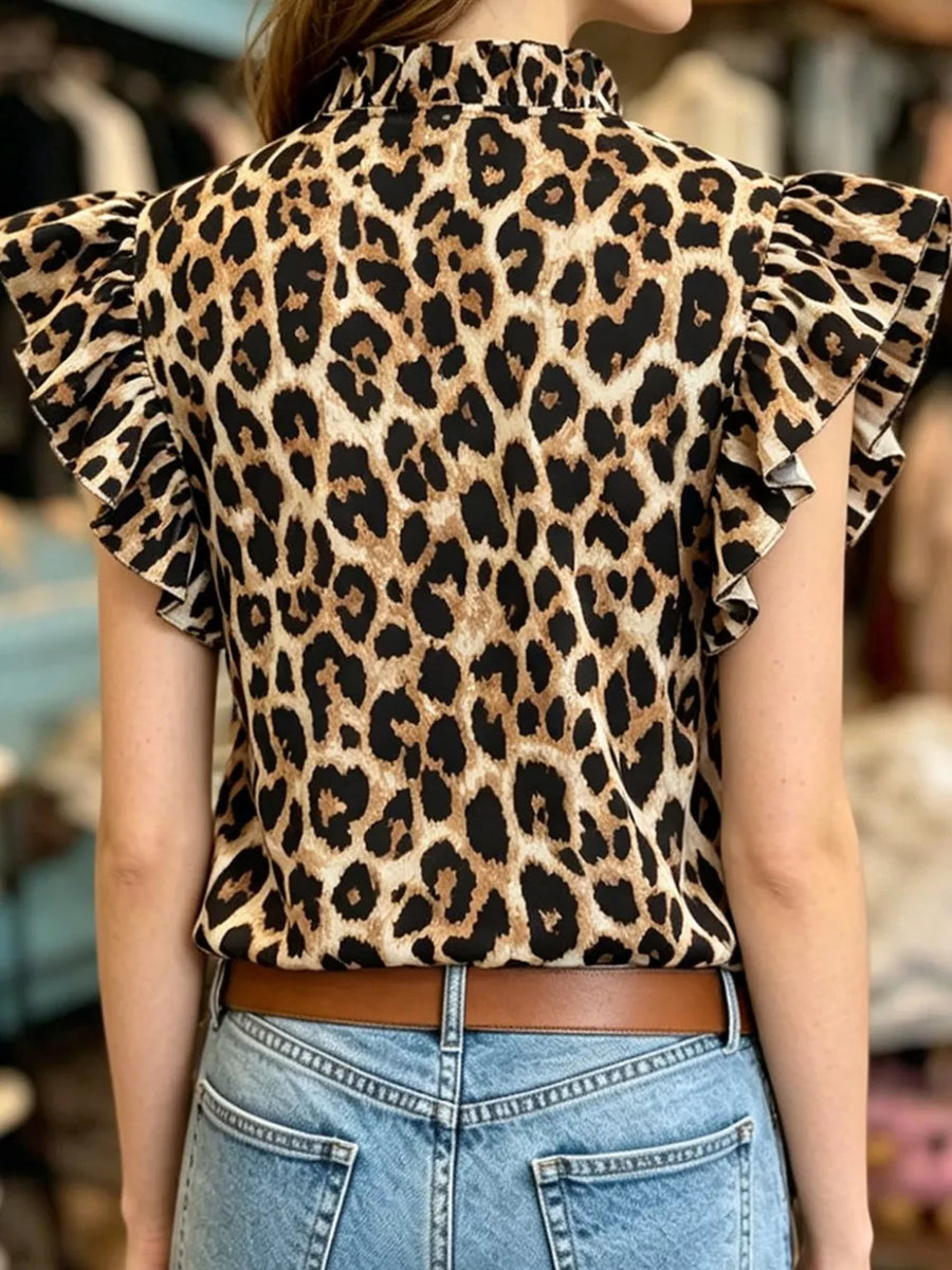 Leopard print t-shirt with ruffled short sleeves and mock neck.