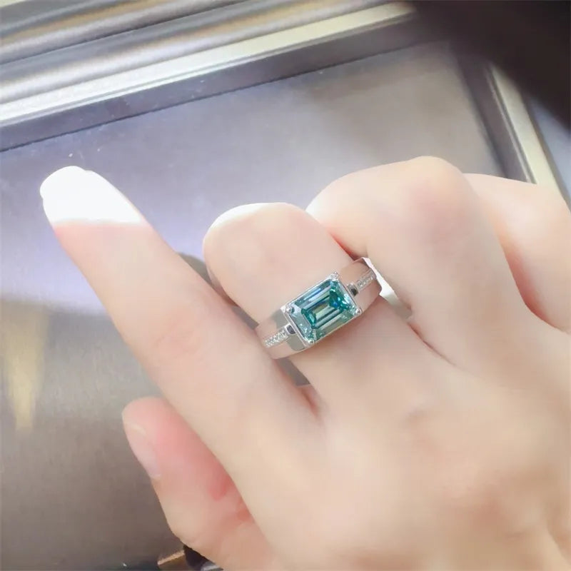 Sterling silver ring with emerald cut moissanite and diamond accents