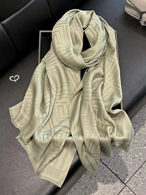 Elegant Tencel cotton scarf in matcha green with geometric pattern and fringe detail