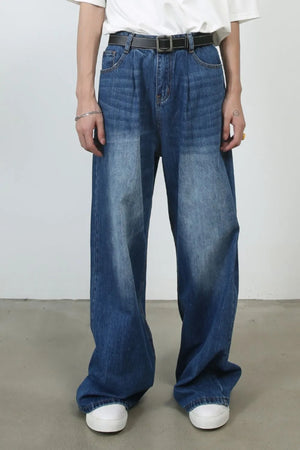 Pleated-front wide-leg denim trousers in peacock blue with a relaxed fit.