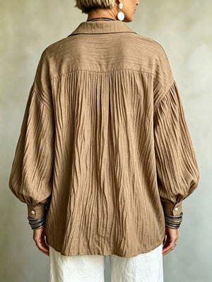 Lavender blouse featuring buttoned and textured