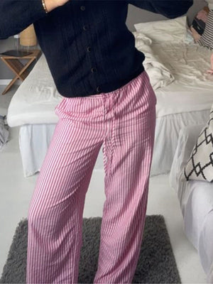 white wide-leg pants featuring drawstring waist and striped