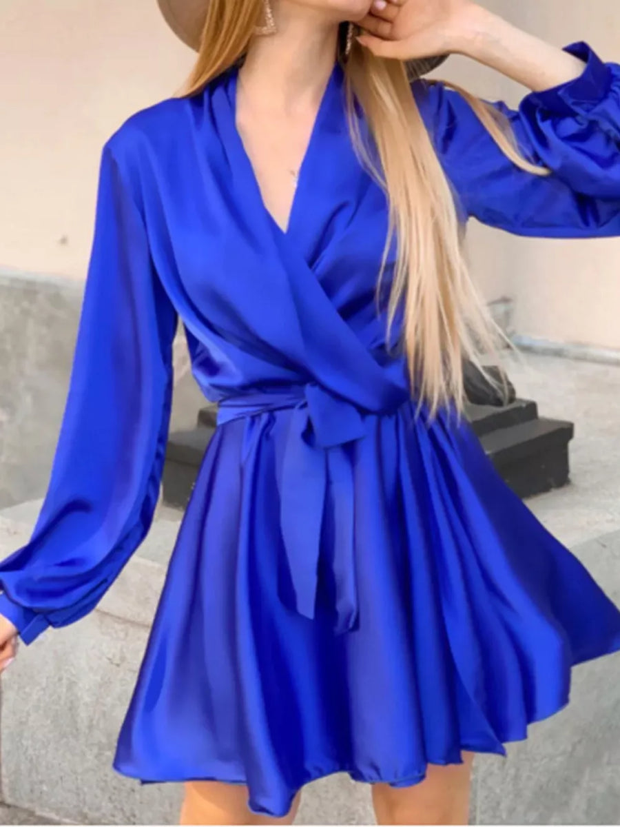 Green mini dress with ruched cuffs and bishop sleeve