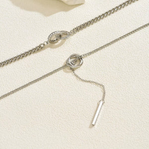 Silver layered Y-shaped pendant necklace with interlocking rings and bar detail
