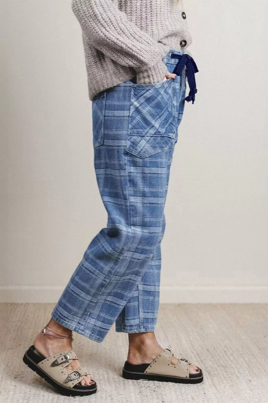 Plaid denim jeans in dusty blue with drawstring waist and grommets.