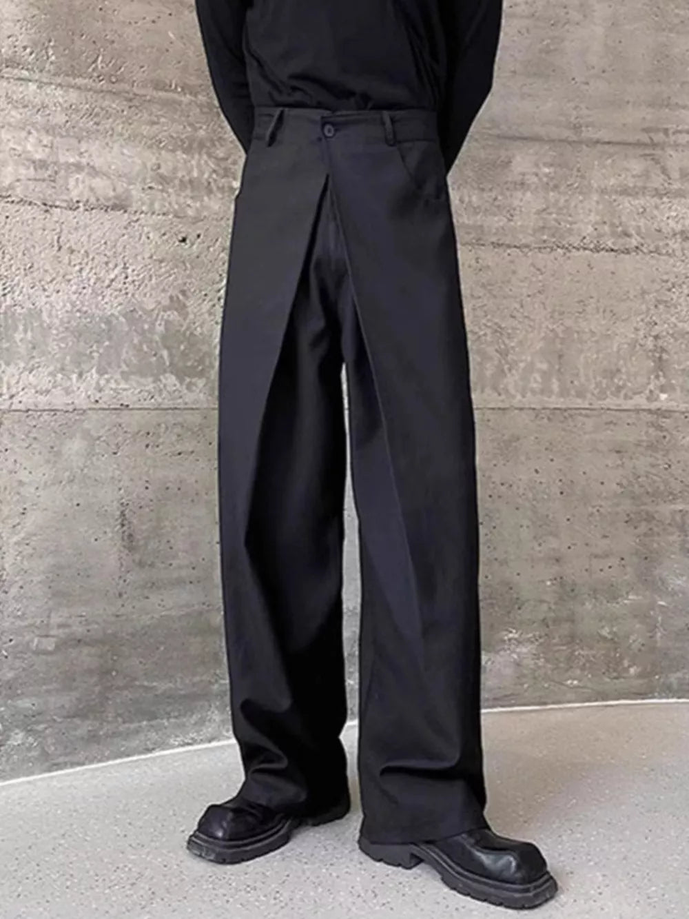Men's black wide-leg dress pants with a unique wrap-style front and a relaxed fit.